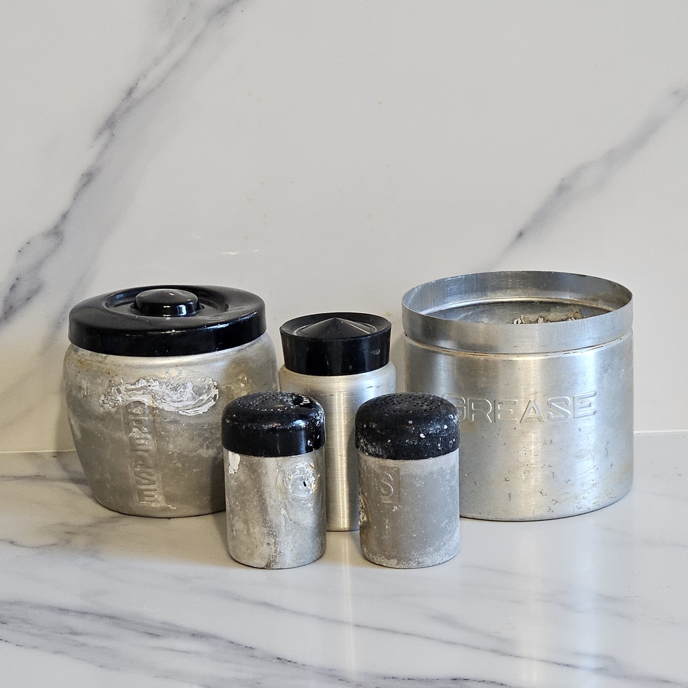 Silver and Black BBQ Grease Containers